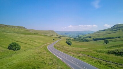 Scenic Open Road Cutting Through Lush Green Countryside Landscape