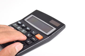 Obraz premium Hands holding and using a calculator isolated on a white background