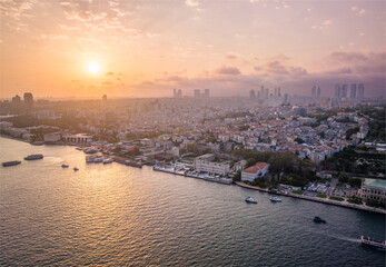 Fototapeta premium Aerial View of Bustling Istanbul City Cityscape Overlooking the Vibrant Waterfront. Turkey. Drone. Sunset