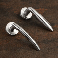 Modern Door Handles on Stone Background