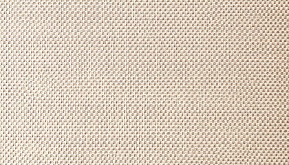 Fototapeta premium Closeup view of a beige woven fabric. The texture is a fine hopsack weave showing small even squares in a subtle pattern. The color is a light neutral beige.