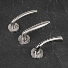 Modern Door Handles on Stone Background