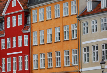 Fototapeta premium facades of the typical houses in the area called Nyhavn in the city of Copenhagen, the capital of Denmark in Northern Europe
