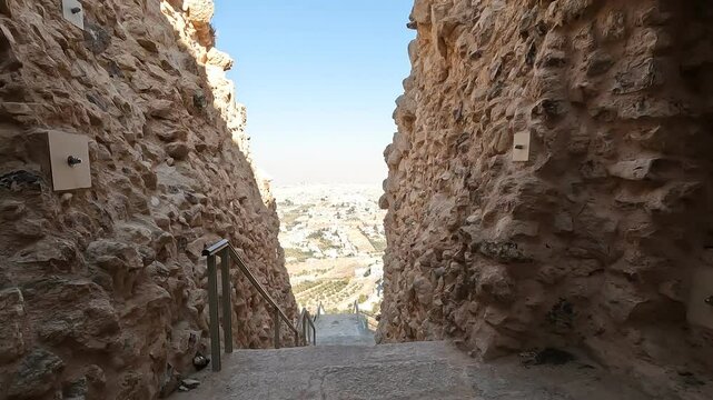 The entrance to Herodium with ancient stone stairs under a bright sunny sky. A stunning historical and archaeological site in Judea, Israel.