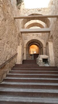 The entrance to Herodium with ancient stone stairs under a bright sunny sky. A stunning historical and archaeological site in Judea, Israel.