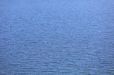 Obraz premium background with the placid saltwater of a calm blue sea without boats, ideal as a marine or nature backdrop