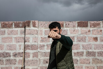 young man fist in street