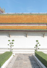 A minimalist-style image of a traditional Thai temple, showcasing clean architectural lines and a simple yet elegant design.