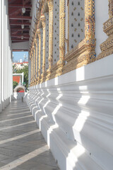 A minimalist-style image of a traditional Thai temple, showcasing clean architectural lines and a simple yet elegant design.