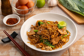 Stir fried konjac noodles with Sweet Black Sauce,stir fry konjac seaweed noodles with garlic sliced pork meat kale and chicken egg with soy sauce (Pad See Ew).healthy low calorie meals.ketogenic diet.
