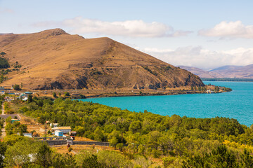Fototapeta premium Sevan, tourist town by the lake. Sevan Lake. Mountain around. Armenia.
