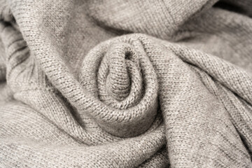 Grey wool sweater texture as a background.