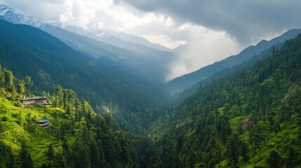 Fototapeta premium A breathtaking view of a lush green valley surrounded by mountains, under a dramatic sky filled with clouds.