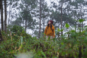 Portrait image of a woman walking in the forest