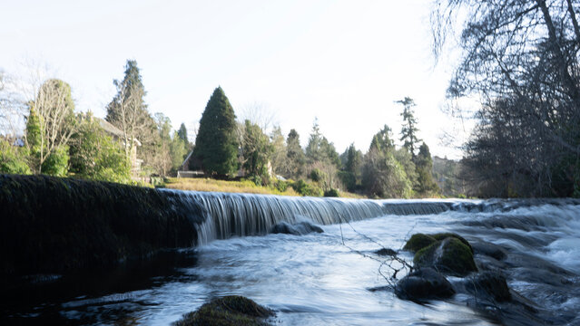 River dochart flowing through killin in scotland, creating a waterfall