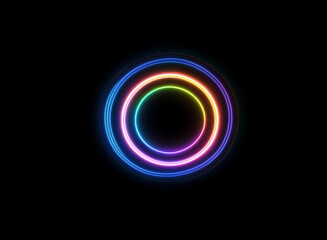 Obraz premium Vibrant rainbow neon circles glow on a black background, creating a hypnotic, concentric design. The bright, multicolored rings radiate energy.