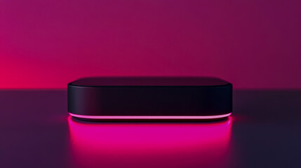 A sleek, modern black wireless device with a soft, glowing pink light
