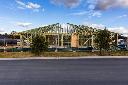 a timber framed house getting built on a new estate near Brisbane