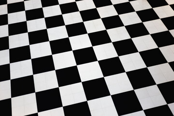 Classic black and white checkered floor tiles in diagonal pattern. Abstract geometric design...