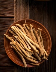 Fresh ashwagandha roots on a rustic wooden table