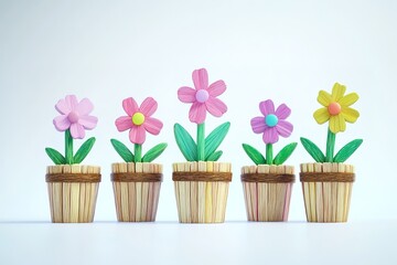 Obraz premium Cute flower pot made of popsicle sticks, the flowers in it have green leaves and colorful petals
