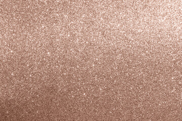 Glowing background with bokeh effect in mocha mousse color 2025.