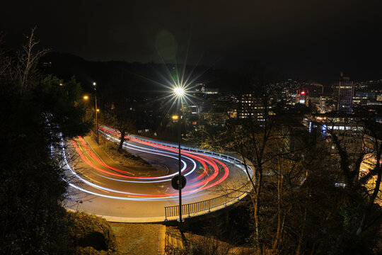long exposure picture of car light trails in a 180 degree curve in Baden, Switzerland