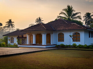 Elegant Kerala-style villa surrounded by lush greenery and serene landscapes. Showcasing...