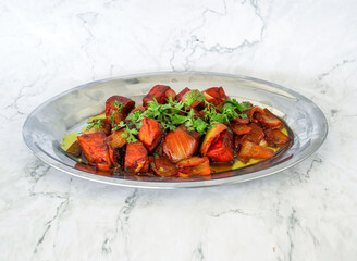 Chili Paneer topping with coriander served in plate isolated on grey background side view of Pakistani and Indian food