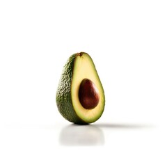 A g ripe avocados, one cut in half to reveal its creamy flesh and large seed.