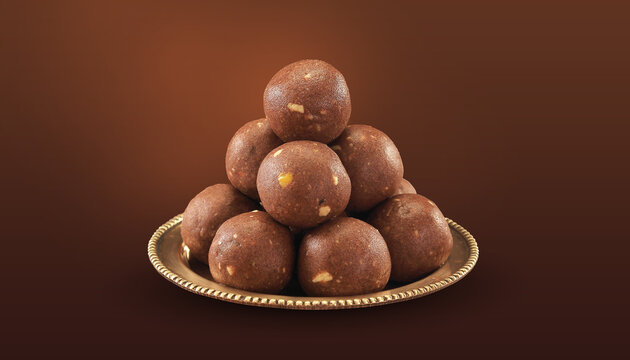 Traditional indian Fresh home made urad dal and millet sweet Nachni laddu or Ragi laddoo or balls made using finger millet, jaggery and ghee. It's a healthy food from India.