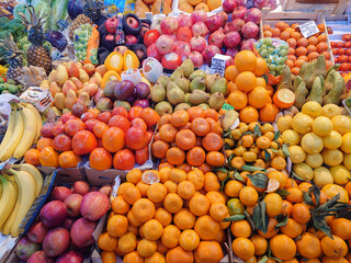 Various vegetables and fruits on the counter of the food market.