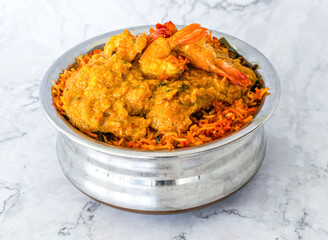 Prawn Biryani served in silver pot isolated on grey background side view of Pakistan and Indian food
