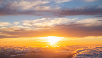 Obraz premium Sun Setting Over Clouds in Sky and Copy Space
