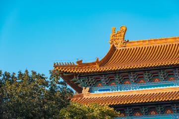 Fototapeta premium Golden colored glazed tile roofs of ancient Chinese palaces