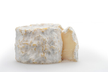 Traditional French goat cheese Crottin de Chavignol isolated on a white background..