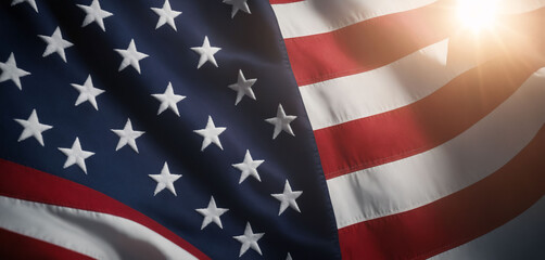 Close-up image of an American flag with backlight