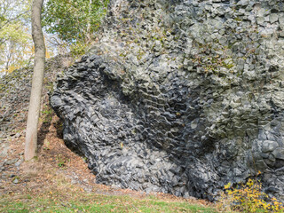 Basalt lava vulcanic rock formation, tile shape in Luzicke hory Lusatian Mountains, Czech Republic.