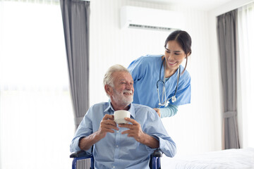 Fototapeta premium Young female nurse explaining information to disabled patients in wheelchairs., Retirement health check-up doctor concept at home.