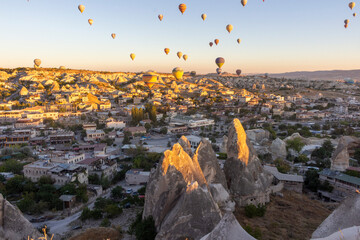 Hot air balloons take off at dawn in Cappadocia