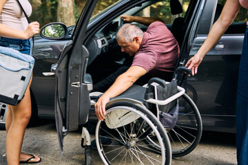 Man in Wheelchair Assisting