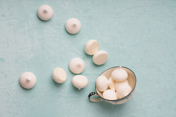 small decorative meringues on a blue background