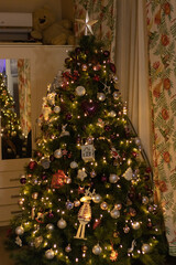 Close up Christmas tree with awesome toys in a cozy living room