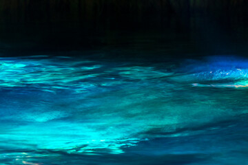 Cenote Minotauro with limestone rocks turquoise water and nature Mexico.