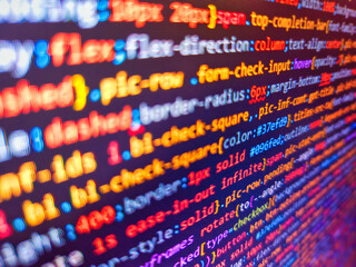 Software development monitor screen background. Software developer programming code. Closeup view...