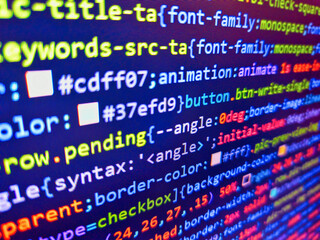 Obraz premium Closeup tablet screen technology background. Virus in program code. Stock market graph and ticker with blue screen for stock exchange analysis. Closeup photo. Binary code. Developer work.