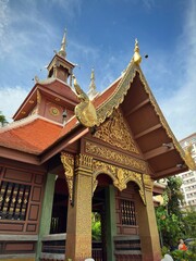 Fototapeta premium Looking up at a red and gold temple (Chiang Mai Thailand)