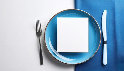 Minimalistic table setting with blue plate and cutlery, menu for restaurant