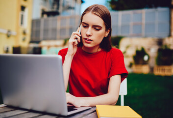 Concentrated professional copywriter enjoying remote work talking with friend using new application...