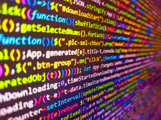 Fragment of a sequin fabric. Closeup view of software code on a computer screen with blurred background words. Abstract screen of web developer. Error and computer problems concepts. Pink color.